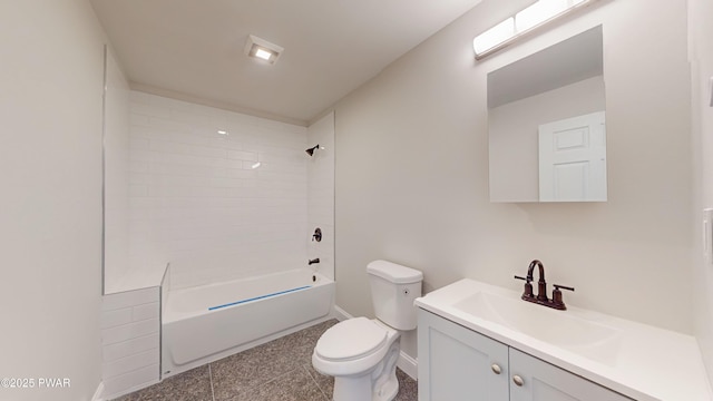 full bathroom featuring vanity, tiled shower / bath combo, and toilet