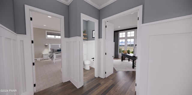 hall with crown molding and dark hardwood / wood-style flooring