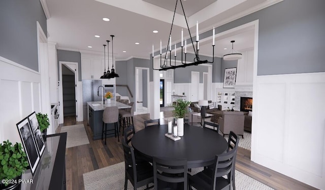 dining area featuring crown molding and dark hardwood / wood-style flooring