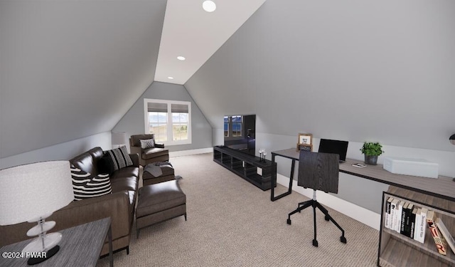 carpeted office featuring lofted ceiling