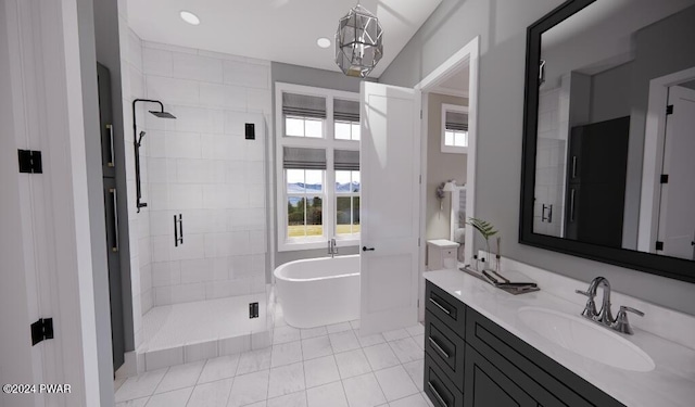 bathroom featuring tile patterned flooring, vanity, an inviting chandelier, and independent shower and bath