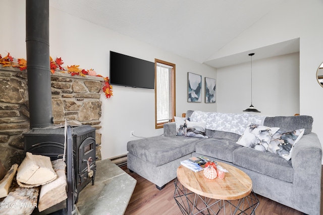 2894 S Fairway Dr, Lake Ariel, PA 18436 - living room featuring a wood stove, vaulted ceiling, wood finished floors, and baseboard heating