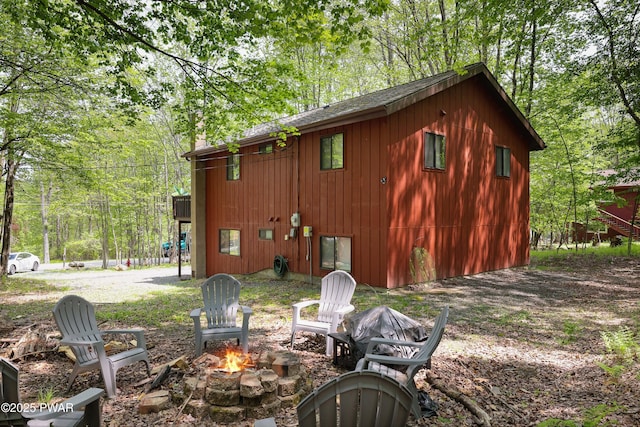 2894 S Fairway Dr, Lake Ariel, PA 18436 - view of side of property with a fire pit and roof with shingles