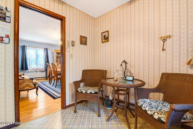 living area with hardwood / wood-style floors