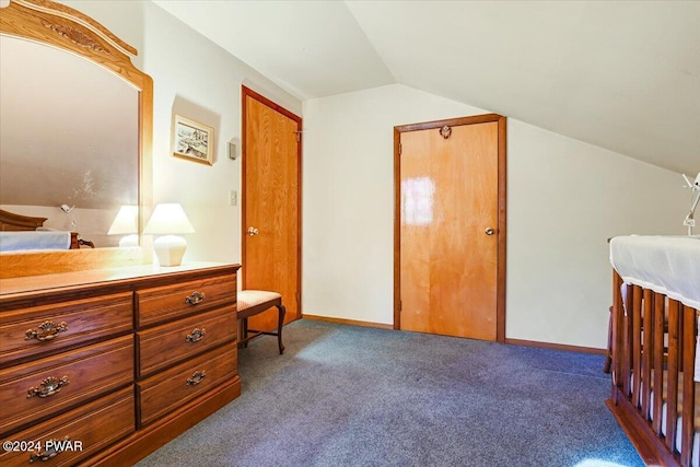 carpeted bedroom featuring vaulted ceiling