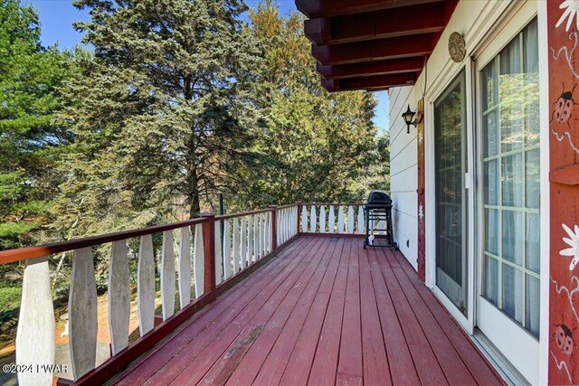 wooden deck with grilling area