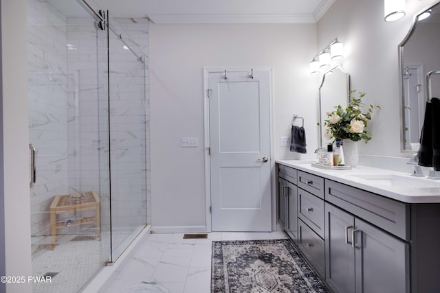 bathroom featuring double vanity, marble finish floor, crown molding, and a stall shower