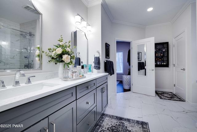 bathroom featuring marble finish floor, crown molding, visible vents, a sink, and a shower stall