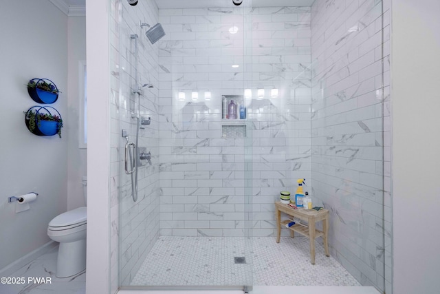 full bath featuring marble finish floor, a shower stall, toilet, and baseboards