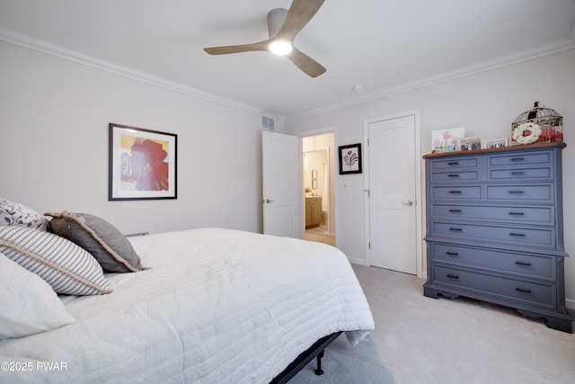 bedroom with ornamental molding, light carpet, visible vents, and ensuite bathroom