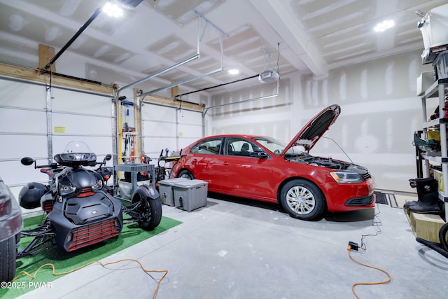 garage featuring a garage door opener