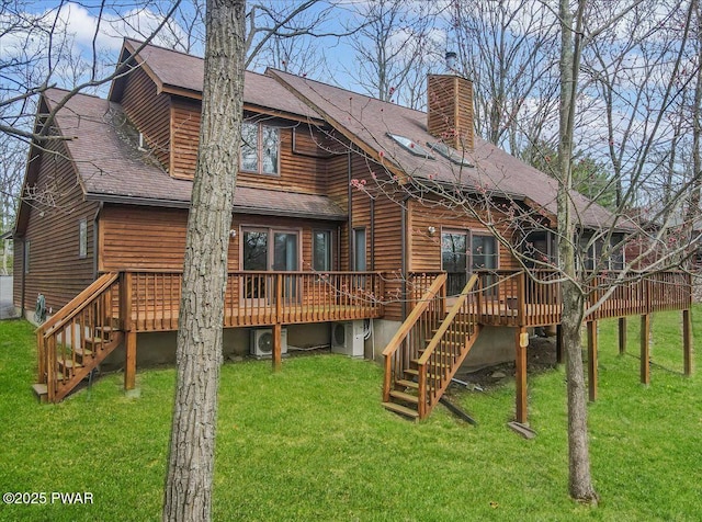105 Beechwood Ln, Greentown, PA 18426 - rear view of property featuring a shingled roof, a deck, a lawn, a chimney, and stairs