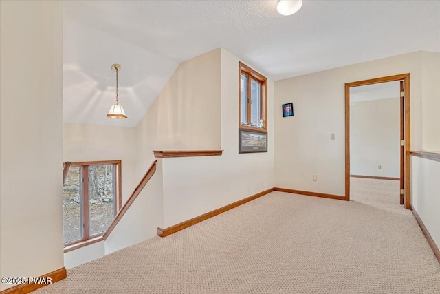 105 Beechwood Ln, Greentown, PA 18426 - spare room featuring carpet flooring, baseboards, and lofted ceiling