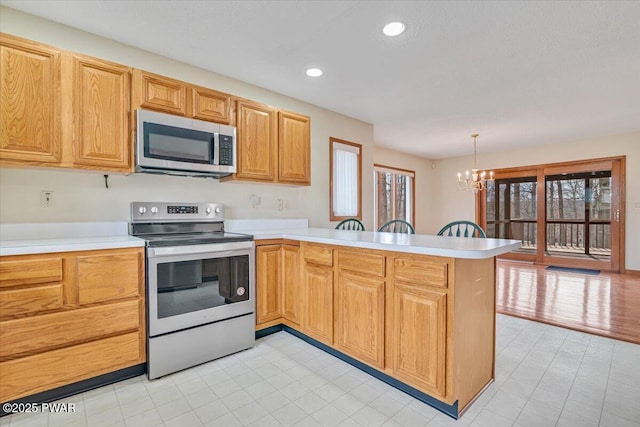 105 Beechwood Ln, Greentown, PA 18426 - kitchen featuring stainless steel appliances, a peninsula, a notable chandelier, and light countertops