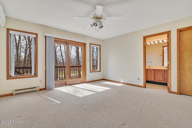 105 Beechwood Ln, Greentown, PA 18426 - spare room with baseboards, ceiling fan, carpet, a textured ceiling, and baseboard heating