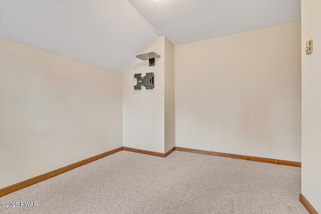 105 Beechwood Ln, Greentown, PA 18426 - carpeted spare room with baseboards, lofted ceiling, and a textured ceiling