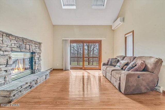 105 Beechwood Ln, Greentown, PA 18426 - living area with wood finished floors, high vaulted ceiling, a fireplace, and an AC wall unit