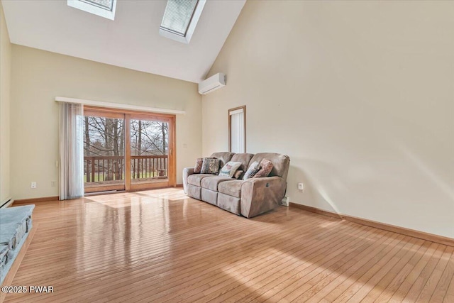 105 Beechwood Ln, Greentown, PA 18426 - living room with baseboards, a wall mounted air conditioner, light wood-style flooring, a skylight, and high vaulted ceiling