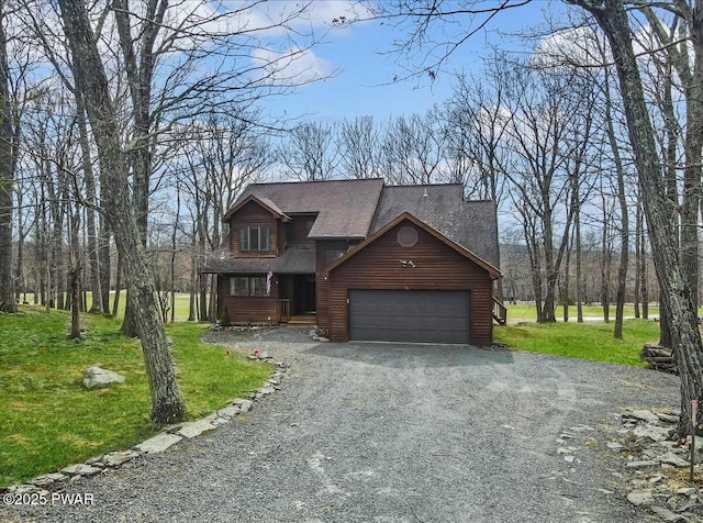 105 Beechwood Ln, Greentown, PA 18426 - chalet / cabin featuring a front yard, roof with shingles, driveway, and an attached garage