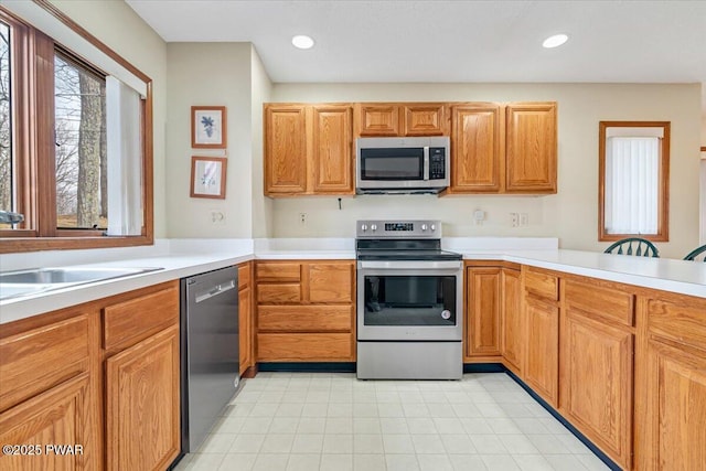 105 Beechwood Ln, Greentown, PA 18426 - kitchen with stainless steel appliances, recessed lighting, light countertops, and a sink