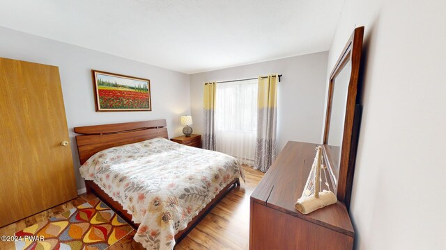 bedroom with light wood-type flooring