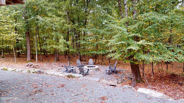 view of patio / terrace featuring an outdoor fire pit