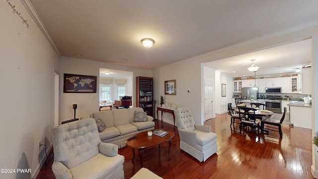 living room with wood-type flooring and crown molding