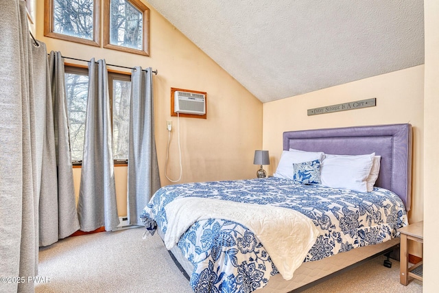 bedroom with carpet flooring, a textured ceiling, a wall unit AC, and lofted ceiling