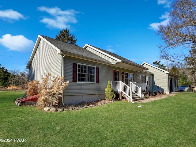 ranch-style home with a front lawn