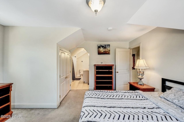 carpeted bedroom with connected bathroom