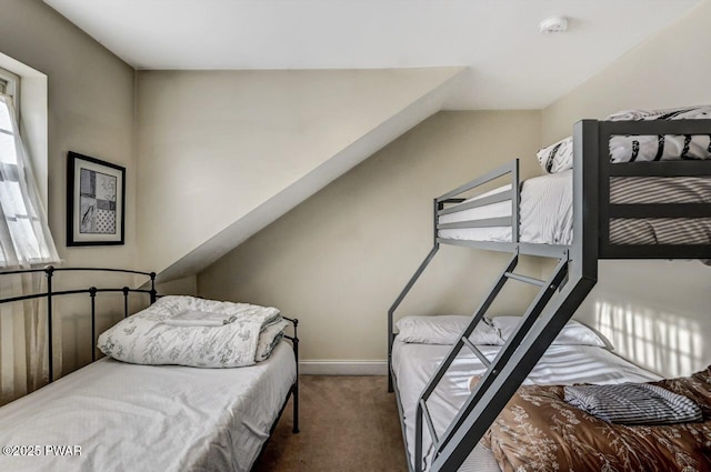 bedroom with lofted ceiling and carpet flooring