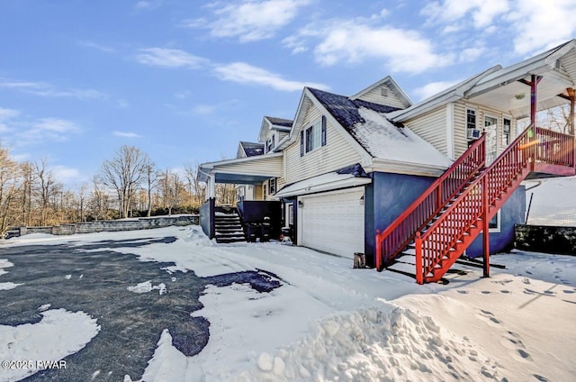 view of snowy exterior with covered porch