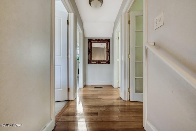 corridor featuring light hardwood / wood-style floors