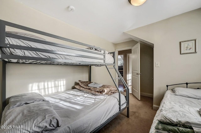 bedroom featuring dark carpet