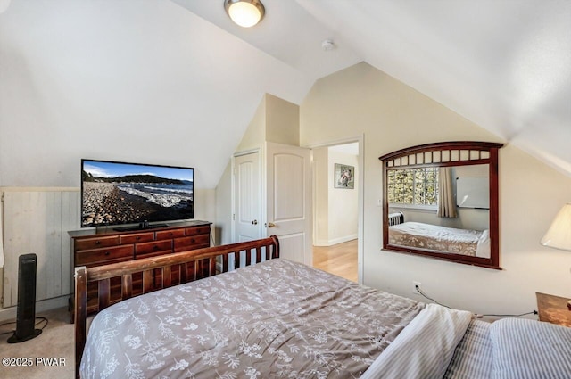 bedroom featuring lofted ceiling