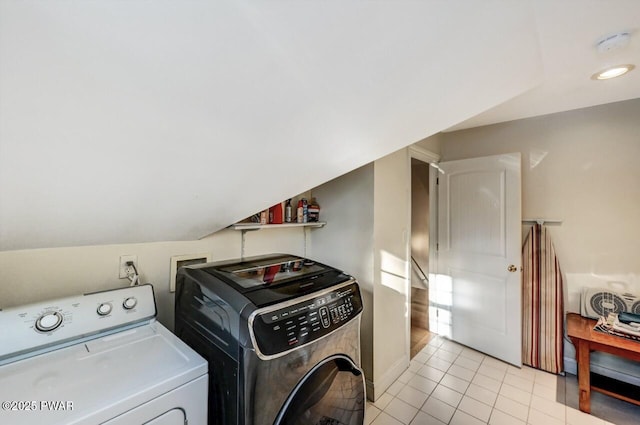 washroom with separate washer and dryer and light tile patterned flooring