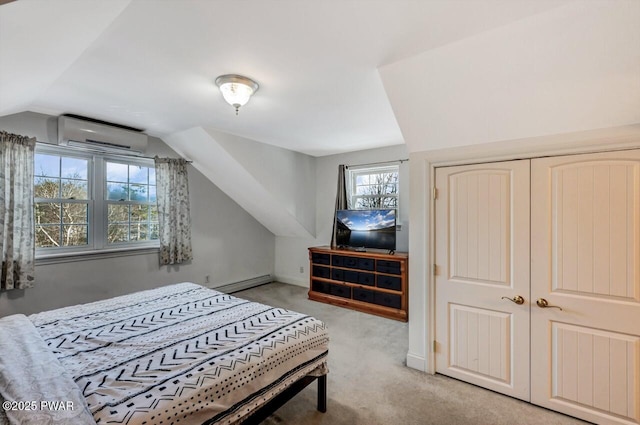 carpeted bedroom featuring a baseboard radiator, a wall mounted air conditioner, vaulted ceiling, and a closet