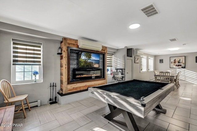 recreation room featuring billiards, a baseboard heating unit, and a wall unit AC