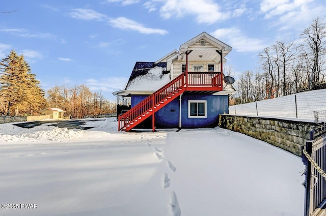 view of snow covered house