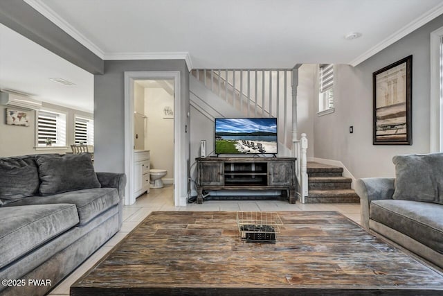 living room with crown molding and light tile patterned flooring