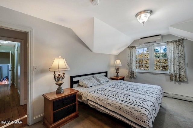 bedroom featuring vaulted ceiling, a baseboard heating unit, and a wall mounted air conditioner