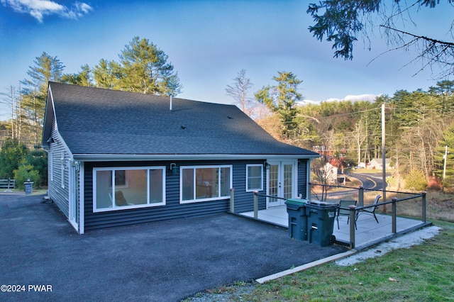 214 Twin Lakes Rd, Shohola, PA 18458 - back of house featuring a shingled roof, french doors, and a patio area
