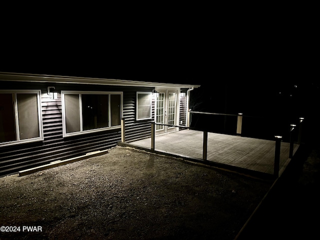 exterior space with french doors and a wooden deck