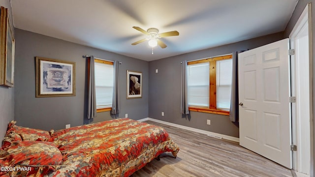 bedroom featuring ceiling fan and light wood-type flooring