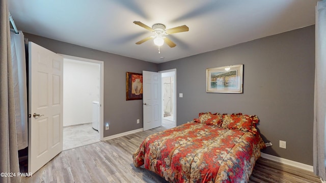 bedroom with hardwood / wood-style flooring, ceiling fan, and ensuite bathroom