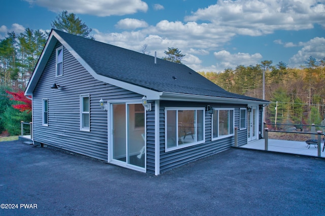 back of house with a patio