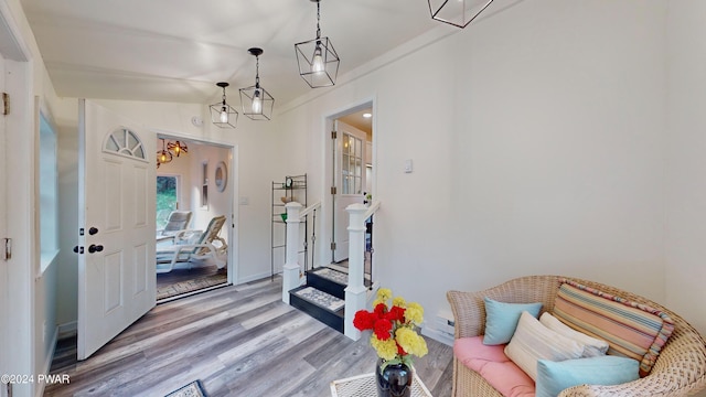 sitting room featuring hardwood / wood-style floors and ornamental molding