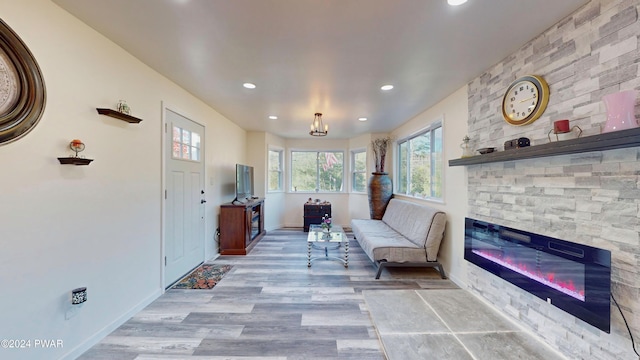 unfurnished room featuring light hardwood / wood-style floors and a fireplace