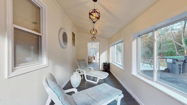 sunroom / solarium featuring a wealth of natural light and vaulted ceiling