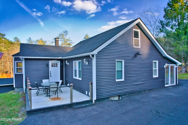 rear view of house featuring a patio